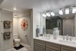 Master en-suite bathroom with dual sink vanity and lavatory